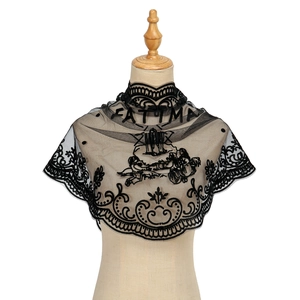 Vintage black lace triangle shawl with FATIMA embroidery and angel pattern on a mannequin