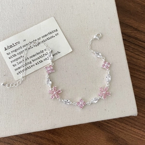 Elegant floral silver bracelet featuring pink zircons and marquise cut clear crystals