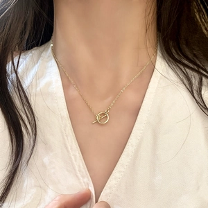 Elegant gold OT toggle clasp necklace with glass beads on a minimalist cable chain