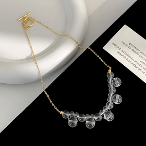 Minimalist gold chain necklace with glass beads and a vintage T-bar OT toggle clasp
