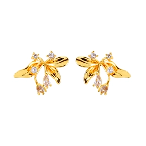 Elegant gold leaf flower earrings with sparkling cubic zirconia stones on white background