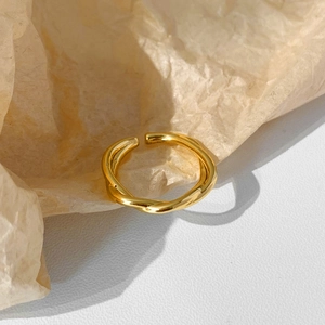 Minimalist gold twisted open ring featuring a sleek adjustable wrap design for women