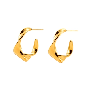 Modern twisted gold C-shaped earrings with a polished finish on a white background