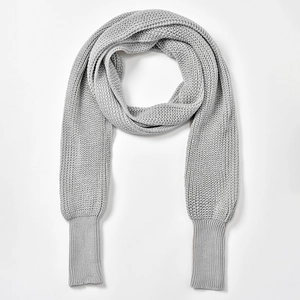 Detail of light grey knitted wrap sweater with ribbed cuffs and batwing sleeve design