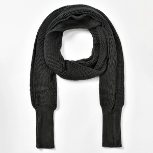 Detailed view of black knitted wrap shawl featuring long ribbed cuffs and chunky knit texture
