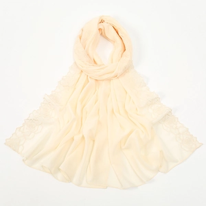 Detail of elegant cream chiffon shawl featuring delicate rose flower embroidery on the edge