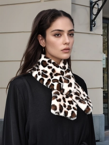 Close-up of leopard print plush scarf in faux fur with a stylish cross-over front wrap