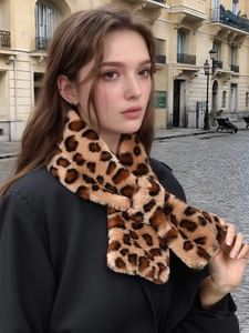 Detail of plush leopard print faux rabbit fur scarf with a warm cross-insert design