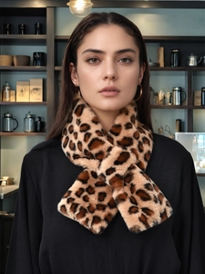 Close-up of leopard print faux rabbit fur scarf with a practical cross-loop design