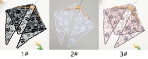 Detailed lace triangle scarf with cherry embroidery in black, white, and dusty pink