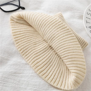 Minimalist beige rib-knit beanie hat in a soft winter thermal style for men and women