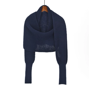 Women's dark blue chunky knit shawl featuring unique long ribbed sleeves and a cozy wrap design