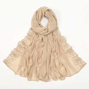 Detailed view of beige chiffon scarf with intricate rose floral embroidery on the edge