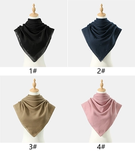 Detail showing four color options of rhinestone studded chiffon hijabs on white mannequins