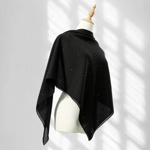 Elegant black square scarf with sparkling rhinestones draped on a white mannequin