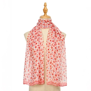 Detailed view of floral georgette scarf fabric texture on a mannequin bust