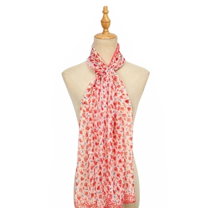Detail of red floral chiffon scarf with vintage print on a beige mannequin model