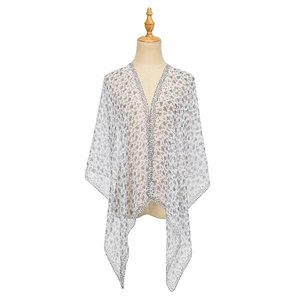 Detail of white floral chiffon shawl featuring a lightweight translucent fabric drape