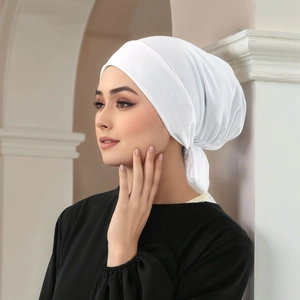 Detail view of white crystal hemp pleated hijab showing the back lace-up strap design