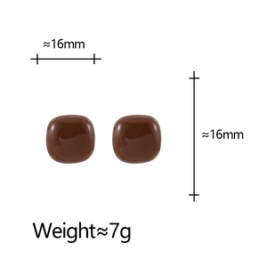 Detail view of brown square enamel earrings with dimensions 16mm x 16mm and 7g weight