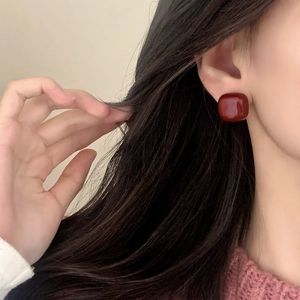 Elegant red square enamel stud earrings shown on model for a stylish daily look