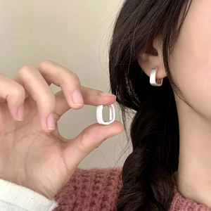 Minimalist matte silver square geometric earrings shown on a model for daily wear