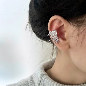 Minimalist silver ear cuff with three square-cut cubic zirconia for non-pierced ears