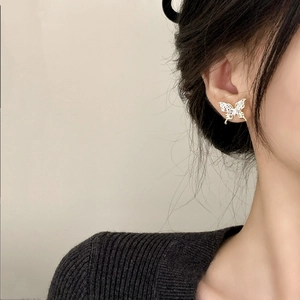 Elegant gold hollow lace butterfly stud earrings with sparkling crystals for women