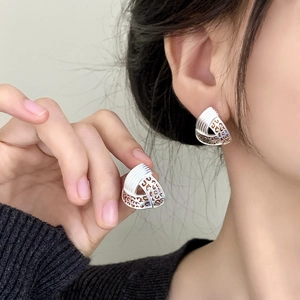 Vintage silver-tone triangle leopard print earrings for women with textured metal finish