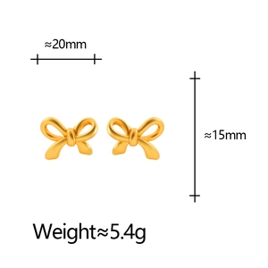 Matte gold bow earrings with minimalist design and 3D texture on white background