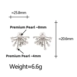 Detailed view of silver firework earrings with pearls and micro-set cubic zirconia stones