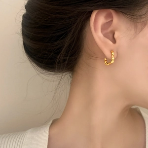 Minimalist gold irregular square earrings featuring a unique textured geometric metal design