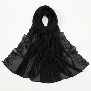 Detail of delicate black rose embroidery on lightweight semi-transparent chiffon shawl
