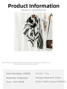 Detailed view of black and white animal print long scarf measuring 190x70cm in polyester
