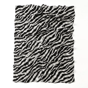 Detail of classic black and white zebra print scarf in lightweight semi-sheer fabric