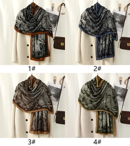 Macro detail of tropical leaf print scarves in four vintage colorways and textures