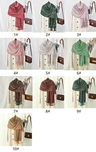 Detailed grid view showcasing 10 color variations of paisley tassel shawls and scarves