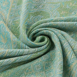 Ethnic paisley jacquard woven shawl with soft fringe details in green and blue tones
