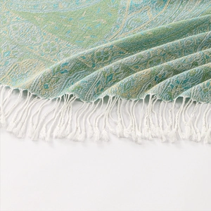 Ethnic paisley jacquard shawl in teal and gold with delicate white woven fringes