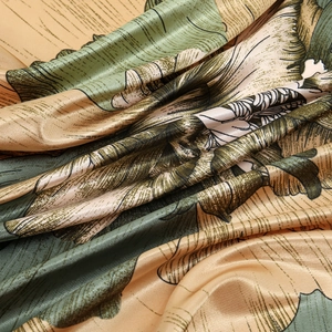 Silk satin square scarf with green botanical leaf print and luxury glossy finish