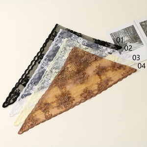 Detail of four floral embroidery lace triangle scarves in black, blue, beige, and brown