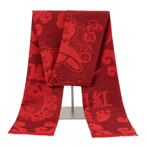 Close-up of red festive scarf with knitted Chinese Fu characters and koi fish motifs