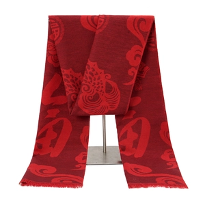 Detail of red jacquard scarf with Chinese Fu character and traditional cloud patterns