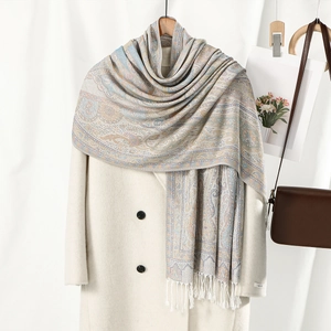Ethnic paisley tassel scarf in light blue and beige paired with a wool coat