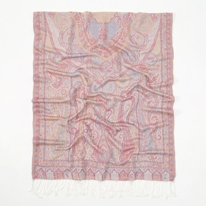 Close-up of pink paisley pattern and white tassels on a soft polyester bohemian scarf