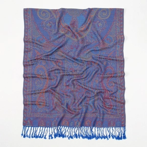 Detailed view of the dark blue paisley pattern and tassel trim on a polyester scarf
