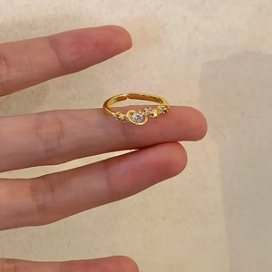 Elegant gold S925 silver adjustable ring featuring star and moon cubic zirconia accents