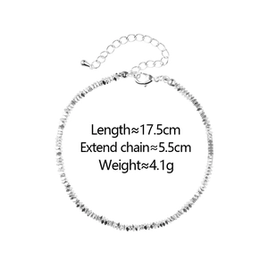 Detailed view of silver multifaceted chain bracelet with extension and teardrop charm