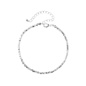 Detail of silver-toned chain with lobster clasp, extender, and water-drop pendant