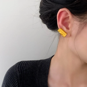 Minimalist gold chunky geometric ear cuff shown on model for elegant daily wear